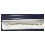 10K GOLD AND GREEN STONE - 7"