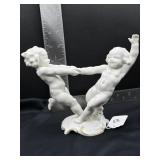 vintage porcelain figurine of two cherubs