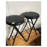 2 BLACK METAL FOLDING STOOLS WITH PADDED SEAT