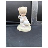 Precious Moments figurine titled "God is Love".