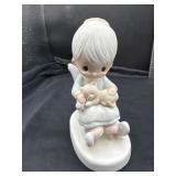 Precious Moments figurine titled "The Purr-fect