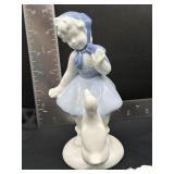 vintage porcelain figurine of a girl with a