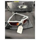 PAIR OF OAKLEY TRIGGERMAN SUNGLASSES W/ TORCH