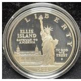 1986 LIBERTY SILVER DOLLAR W/BOX AND COA