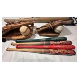 4 small bats, 2 gloves, two balls, 1 bat