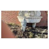 Concrete garden statue of a police officer