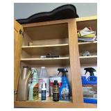 Contents of shelves mostly floor cleaner supplies