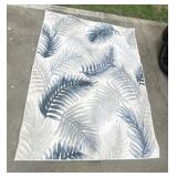 Four outdoor area rugs