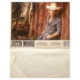 A promo  photo of Justin Moore/autographed