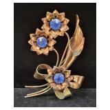 STERLING SILVER AND BLUE STONE FLORAL BROOCH -