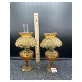 PAIR OF AMBER SMALL OIL LAMPS (1 MISSING CHIMNEY)