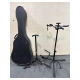 2 GUITAR STANDS AND A GUITAR CASE