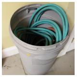 Rubbermaid Trash Bin Filled w/ Garden Hoses