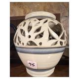 This handmade reticulated pottery luminary