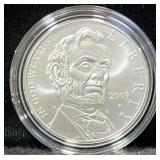 2009 ABE LINCOLN COMM. UNC SILVER DOLLAR -
