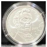 2009 ABE LINCOLN COMM. UNC SILVER DOLLAR -