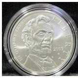 2009 ABE LINCOLN COMM. UNC SILVER DOLLAR -