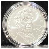 2009 ABE LINCOLN COMM. UNC SILVER DOLLAR -