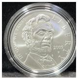 2009 ABE LINCOLN COMM. UNC SILVER DOLLAR -