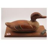 CARVED DECOY OF BASE WITH SHOTSHELL