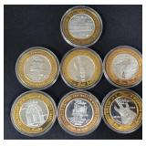 (7) 2001 RENO HILTON $10 BI-METALLIC GAMING TOKENS