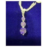 THREE-STONE PURPLE GEMSTONE & STERLING SILVER