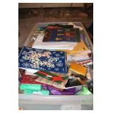 BIN FULL OF HOLIDAY GIFT WRAP