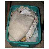 BIN WITH WOOL SCARVES AND TABLE LINENS