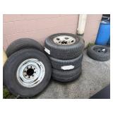 Six wheels and tires, three unused tires three  P