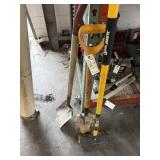 Two shovels and a job site brush