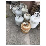 Eight old empty propane tanks