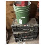Boxes and screws and a bucket of red  trays