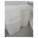 1 FULL AND 1 PARTIAL 7 GALLON JUGS OF GLYCERIN