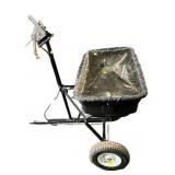 Tow behind seeder/spreader