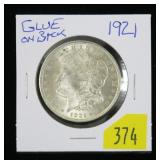 1921 Morgan dollar, BU, glue on back