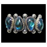 Sterling dentil set pear shape blue paua 4-stone