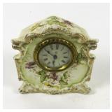 Ansonia wind up clock in porcelain case 5 1/2"