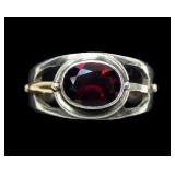 Sterling silver oval cut bezel set garnet ring,
