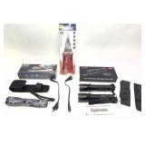 Lot: 3 flashlights/stun gun in boxes and