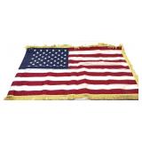 American flag with gold fringe