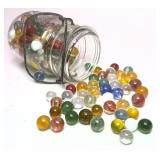 Vintage glass jar with collection of marbles