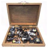 Lot: Wooden box with 9 assorted reels, includes