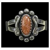 Sterling silver dentil set goldstone ring in split