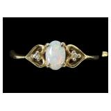 10K Yellow gold cabochon opal ring with diamond