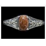 Sterling silver prong set goldstone ring, size 5