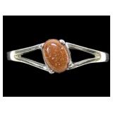 Sterling silver prong set split shank goldstone