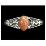 Sterling silver prong set goldstone ring in
