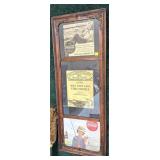 Vintage framed advertisements including