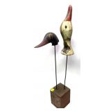 Carved decoy head display with wooden base