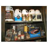 2 SHELVES VARIOUS OIL CANS AND HAVOLINE BOX